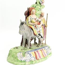 Early 19th century Obadiah Sherratt Pearlware group 'Flight to Egypt', c1820, modelled as the Holy Family with a donkey before bocage, on a scroll moulded base, H21.5cm x W19cm 