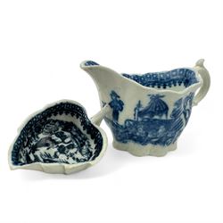 Caughley cream boat of Chelsea ewer form, L11cm and a Caughley leaf-form butter boat moulded on the underside with three leaves, L7cm, both printed in the 'Fisherman' pattern (2)