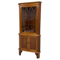 Georgian design mahogany floor standing corner display cabinet, astragal style glazed door enclosing two glass shelves, fitted with double panelled cupboard to base