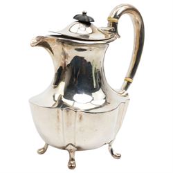 Silver oval teapot with ebonised lift, ivory insulators, loop handle and raised on four shaped supports and matching hot water jug Sheffield 1922/3 Maker Fenton Bros. Ltd. This item has been registered for sale under Section 10 of the APHA Ivory Act