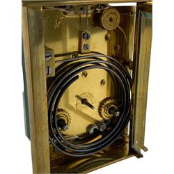 French - early 20th century two train carriage clock, in an onyx serpentine case raised on bun feet, with four bevelled panels and rectangular escapement viewing panel, white enamel dial with Roman numerals and steel spade hands, 8-day movement with a jewelled lever platform escapement and rack striking, sounding the hours and half hours on a coiled gong. With key.