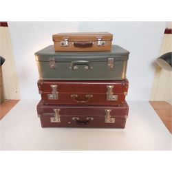 Three Suitcases and a Hand Case