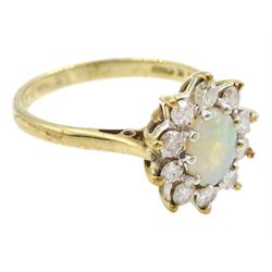 9ct gold oval opal and round brilliant cut diamond cluster ring, London 1982, total diamond weight approx 0.30 carat