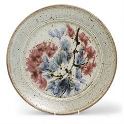 Mick Arnup (1925-2008) Wall charger decorated with blue and pink flowers, signed to the base D37cm 