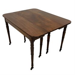 Regency mahogany extending dining table, rectangular moulded top with rounded corners, pull-out concertina action with four additional leaves, on eight ring turned supports with brass castors 