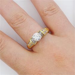 18ct gold round brilliant cut diamond ring, with channel set tapered baguette and round brilliant cut diamond shoulders, stamped, principal diamond weight approx 0.75 carat, total diamond weight approx 1.15 carat