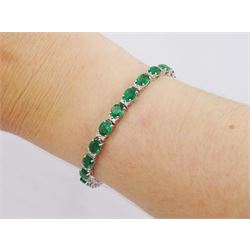 18ct white gold oval cut emerald and round brilliant cut diamond bracelet, stamped, total emerald weight approx 8.30 carat