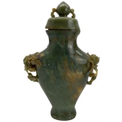 Chinese green hardstone vase and cover, the handles carved as flower heads and leaves H18cm