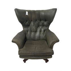 G-Plan - mid-20th century 'Blofeld' model 62 swivel wingback armchair, upholstered in green faux leather, on castors