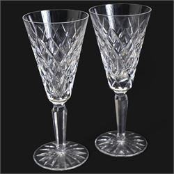 Suite of Waterford Tyrone pattern crystal to include six water goblets, H18cm, six red wine glasses, H17cm, seven white wine glasses, H16cm, six champagne flutes H18cm, six port glasses H14cm, nine champagne coupes, eight tumblers, six dessert bowls and serving/ fruit bowl