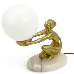 Art Deco gilt patinated spelter table lamp, modelled as a semi-nude female, kneeling with arms outstretched and holding the globular opaque glass shade, mounted upon an oval alabaster plinth, H27cm 