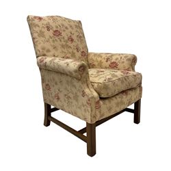 Peter Dudgeon - Georgian design mahogany framed armchair, shaped cresting rail over sprung back and seat flanked by rolled arms, upholstered in floral patterned fabric with matching seat cushion, on square supports joined by stretchers
Provenance: From the Estate of the late Dowager Lady St Oswald