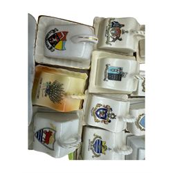 Collection of crested ware miniature cheese dishes and covers, including one by Goss, in one box