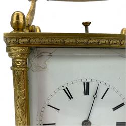 Auguste of Paris - mid-19th century carriage clock in a foliate engraved case with acorn finials and conforming carrying handle, white enamel dial with makers name, Roman numerals, minute track and fine matching steel moon hands,  engraved rear door revealing a twin train going barrel movement striking the hours and half hours on a bell, with the original jewelled lever platform escapement and repeat function, back plate stamped Auguste-Paris, 