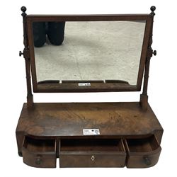 George III mahogany toilet mirror, rectangular plate on ring turned supports with swing action, three drawers with simulated ivory escutcheon, on ebonised bun feet