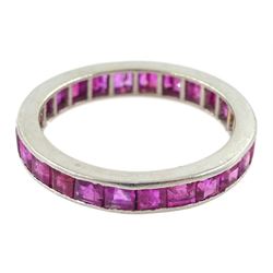 Platinum channel set calibre cut ruby and round cut diamond full eternity ring, the band with engraved decoration, stamped PLAT, total diamond weight approx 0.15 carat