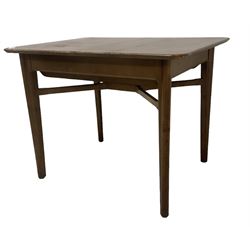 Mid-20th century teak extending dining table, rectangular top with rounded corners, raised on shaped tapering supports united by X-stretcher, with additional leaf