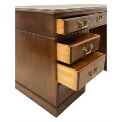 Late 19th century mahogany twin pedestal desk, moulded rectangular top with inset leather, fitted with nine drawers, on plinth base