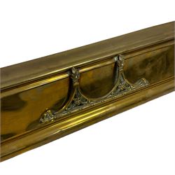 Early 20th century brass adjustable fire fender, scrolling foliate decoration with raised gallery, max aperture 146cm; together with three others (4)