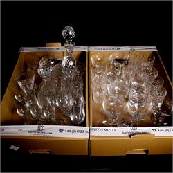 Quantity of table glass and other glassware, including three decanters, one with silver sherry label, two vases, various drinking glasses including Stuart examples, tumblers, flutes, sundae dishes, etc, contained in two boxes