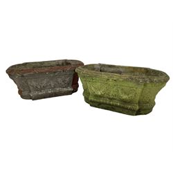 Pair of cast stone garden planters, rectangular form with stepped rounded ends, foliate moulded rim, the body decorated with floral and fruit festoons over gadrooned moulding