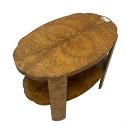 Early to mid-20th century figured walnut coffee table, shaped form with two tiers, quarter-matching veneers 