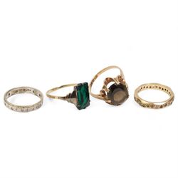 9ct gold oval smoky quartz ring, hallmarked London 1975, green paste ring, stamped 9ct, 9ct gold white spinel eternity ring and another eternity ring stamped 9ct & Sil (4)