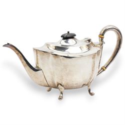 Silver oval teapot with ebonised lift, ivory insulators, loop handle and raised on four shaped supports and matching hot water jug Sheffield 1922/3 Maker Fenton Bros. Ltd. This item has been registered for sale under Section 10 of the APHA Ivory Act