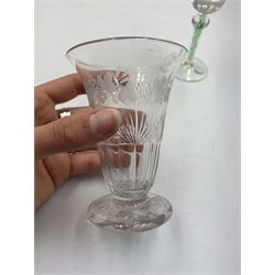 19th century continental liqueur glass, circa 1870, bucket bowl with bubble decoration, the tapered stem with green and white strands, H12.5cm; together with a Victorian aperitif glass, trumpet bowl decorated with foliate and fruiting vines, H10cm (2)