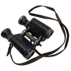 Pair of early 20th century binoculars with filter on one eye piece and a Pathe cine camera