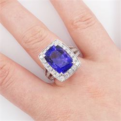 18ct white gold tanzanite and round brilliant cut diamond cluster ring, with diamond set shoulders, hallmarked, tanzanite approx 9.25 carat, total diamond weight approx 1.30 carat