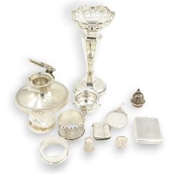 Group of silver including George V silver capstan inkwell, hallmarked Walker & Hall Sheffield 1929, silver trumpet vase with pierced rim, H16.5cm, two napkin rings, matchbook holder, vesta case, pill box, condiment, timble, Queen Victoria 1890 crown pendant and coin ring 