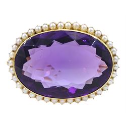 Early 20th century gold large oval cut amethyst and seed pearl brooch, stamped 15ct