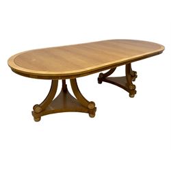 Contemporary Regency design oak and maple extending dining table - two D-ends with maple cross banding, on three curved pillar supports decorated with turned roundels, concaved triangular platform on turned bun feet, with additional leaf