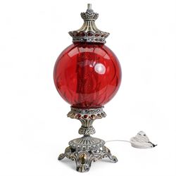 Vintage pierced brass table lamp in the form of an oil lamp, with red glass shade, H61cm