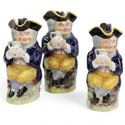 Set of three graduated Hearty Goodfellow toby jugs, H28cm and smaller, together with a blanc de Chine model of a man with a cart (4)