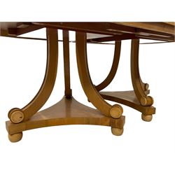 Contemporary Regency design oak and maple extending dining table - two D-ends with maple cross banding, on three curved pillar supports decorated with turned roundels, concaved triangular platform on turned bun feet, with additional leaf