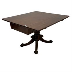 Victorian mahogany Pembroke supper table, fitted with single drawer, drop-leaf top on turned pedestal, four splayed supports with large carved paw feet on castors