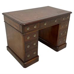 Victorian mahogany twin pedestal desk, moulded rectangular top with rounded corners and inset leather writing surface, fitted with nine drawers, on moulded plinth base