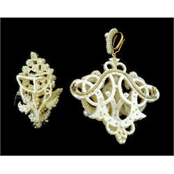 19th century seed pearl knot pendant brooch, of scrolling knot design suspended from a detachable matching bail, mounted to mother of pearl backing, together with a section designed as a bunch of grapes (2)