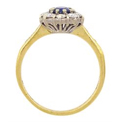 18ct gold oval cut sapphire and round brilliant cut diamond cluster ring, with diamond set shoulders, London 1990, total diamond weight approx 0.60 carat