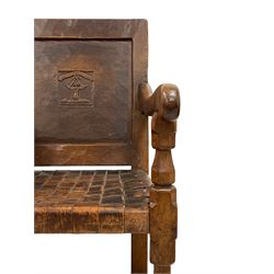 Mouseman - circa. 1930s set of six (4+2) oak dining chairs, panelled back carved with the Bagshawe family crest, the moto 'Forma Flos Fama Flatus' over an arm grasping a bugle-horn with ribbon tie and Yorkshire rose motif, adzed frame, leather lattice strap seat, on octagonal supports united by stretchers, two carvers and four side chairs, each carved with mouse signature, by Robert Thompson of Kilburn 

Provenance - the chairs were owned by Edward Bagshawe, the eldest son of the Staithes Group artist J.R. Bagshawe. On the death of Edward they were passed to the vendor. They have been in the family for almost 95 years. 