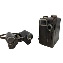 Pair of early 20th century binoculars with filter on one eye piece and a Pathe cine camera