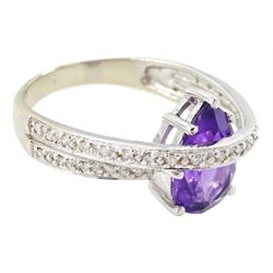 18ct gold amethyst and diamond ring, pear cut amethyst to a diamond set crossover band, stamped 750