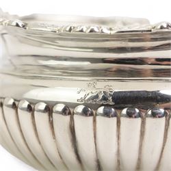 Late Victorian silver two handled sugar bowl with shell moulded and gadrooned border and leaf capped handles, crest of a lion passant and half body fluted decoration and matching milk jug London 1895 Maker Messrs Barnard (2)