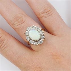 18ct gold opal and round brilliant cut diamond cluster ring, stamped, total diamond weight approx 1.00 carat