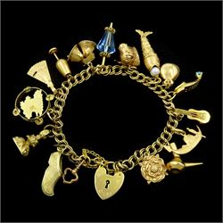 9ct gold double curb link bracelet, with heart locket clasp and sixteen gold charms including articulated fish, bloodstone intaglio fob seal, Mallorca tambourine, gondola and Yorkshire rose