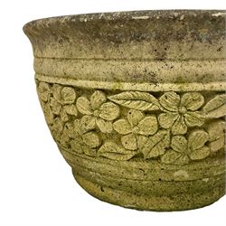 Circular cast stone garden planter decorated with flower head band (D44cm, H28cm); smaller planter (D34cm, H27cm); composite stone rusticated bird bath, octagonal top on tapering pedestal (W41cm, H65cm) (3)