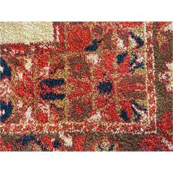 Moroccan amber ground thick pile rug, the plain ivory field decorated with a central pole medallion of star form, the wide guard bands decorated with repeating geometric and foliate patterns