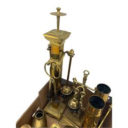 Two Trench Art shell cases, two part brass companion sets and other fire irons, 19th century and later brass candlesticks including a pair of George III oval candlesticks and other brassware in one box